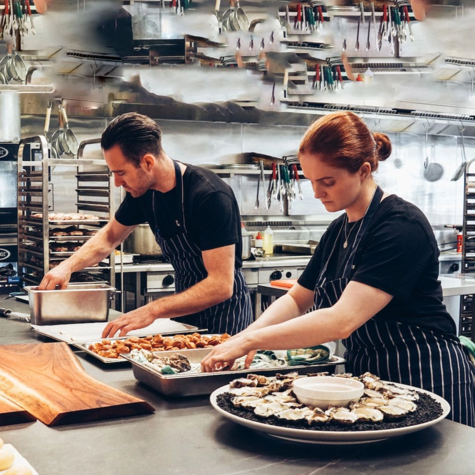 Image of chefs preparing food.