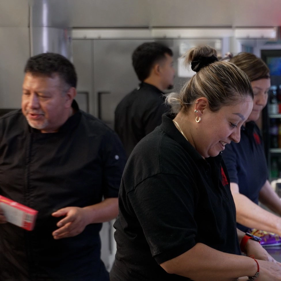 Image of chefs preparing meals.